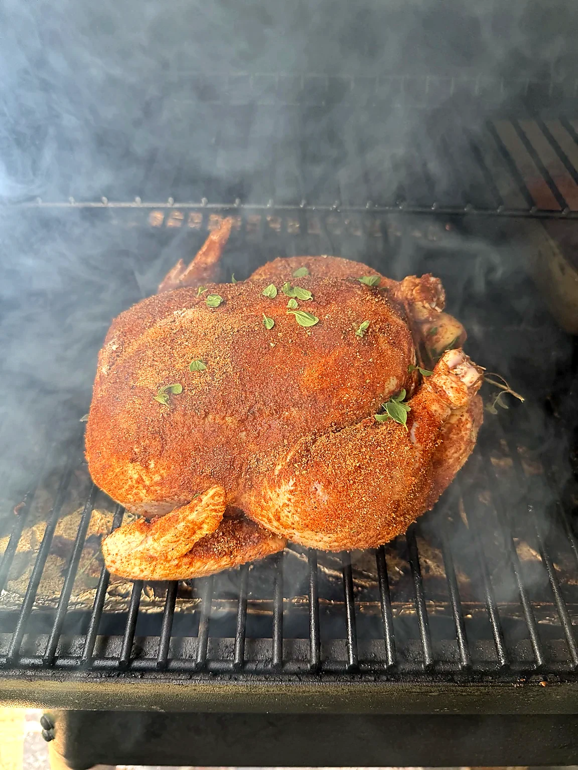 Chicken taking on color and smoke on the Traeger.
